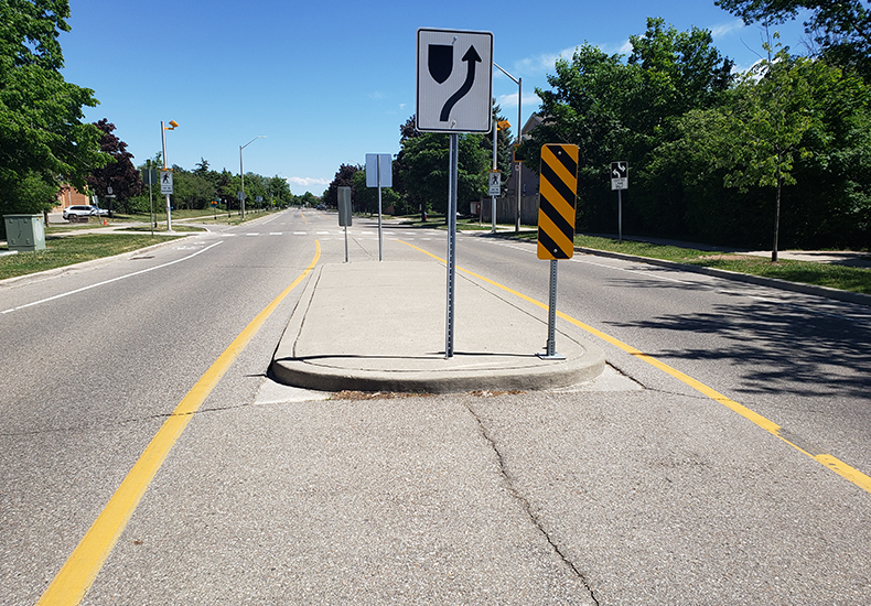 Raised centre medians are one of the traffic calming measures implemented in the Town of Oakville to help reduce traffic speed and volume.