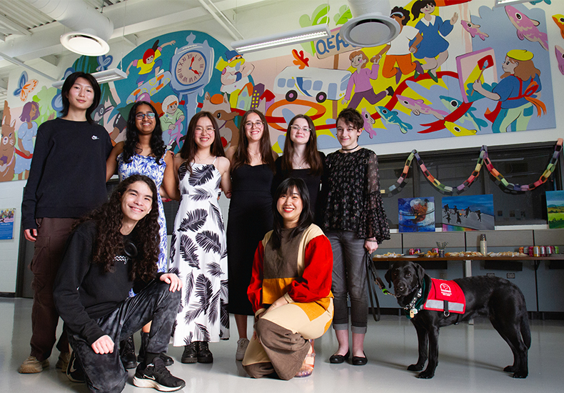 2024 Oakville Youth Awards - Youth mural artists with lead professional artist Group photo of the 2024 Oakville Youth Awards youth mural artists with the lead professional artist. Back row (all youth mural artists): Stella Gao, Ira Parasnis, Jeanne Lee, Olivia Pereira Cancela, Marianna Budnyak, Emma Cloutier, Echo the guide dog. Front row: Zachary Laflamme (youth mural artist), Yen Linh Thai (lead professional artist).