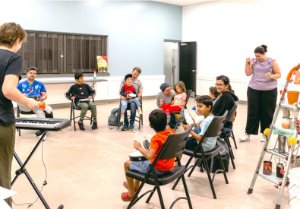Children and parents playing instruments at Bandology Culture Days event