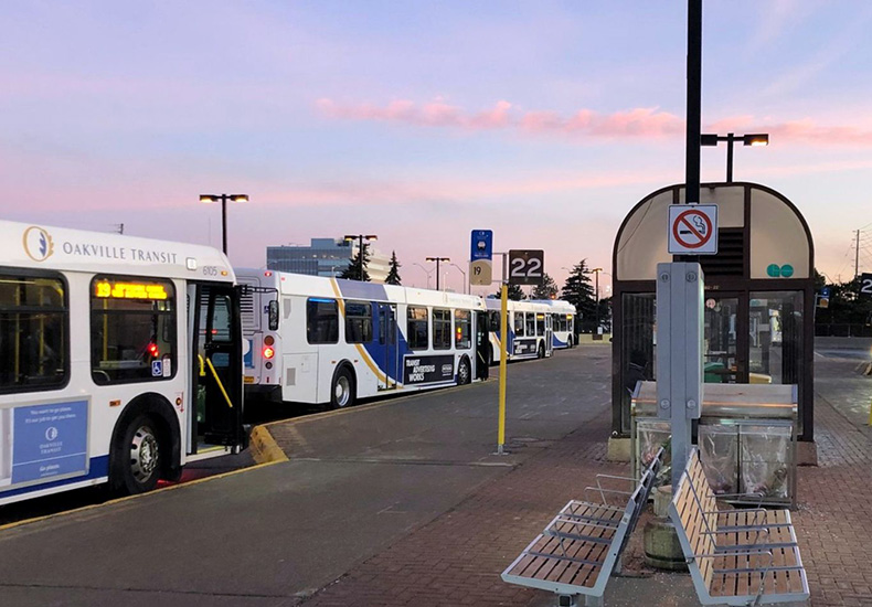 Transit station with buses in evening