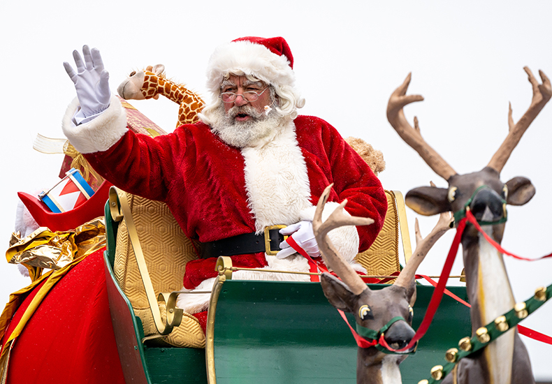 Santa waving from his sleigh during the Santa Claus Parade in Oakville.