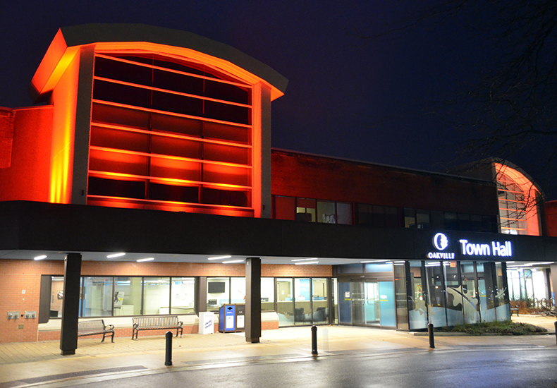 Oakville Town Hall lit by orange lights Oakville Town Hall is lit by orange lights for National Day of Truth and Reconciliation and Orange Shirt Day
