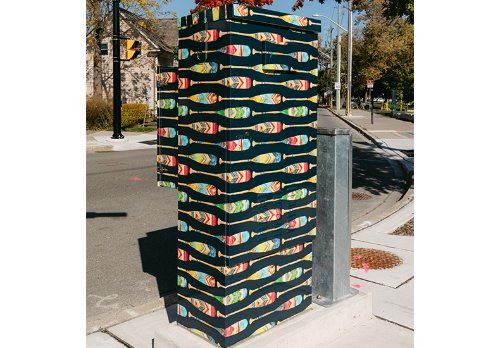 Traffic signal cabinet box wrap featuring an abstract watercolor design of colorful oars.