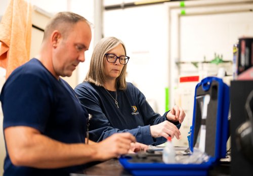 Two staff members working on an assignment.