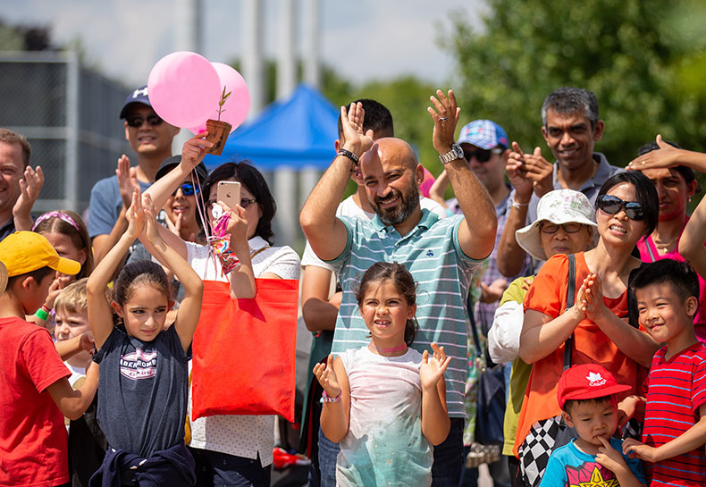 People enjoying an outdoor event Community Activation Grant