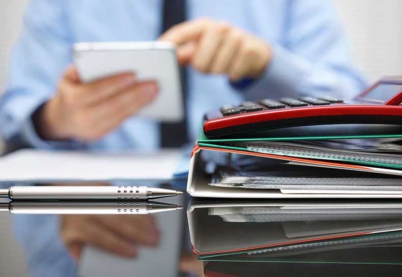 Image of binders and calculator